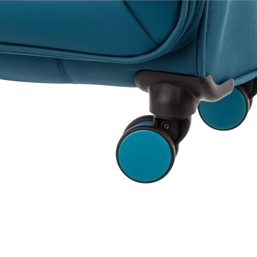 Close-up of the teal fabric and smooth-rolling double wheels on a Lieblingstasche Lightstyler Spinner L suitcase.