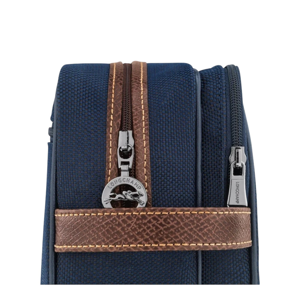 Lieblingstasche Longchamp Boxford toiletry bag in navy blue canvas with brown leather trim and silver zipper details.