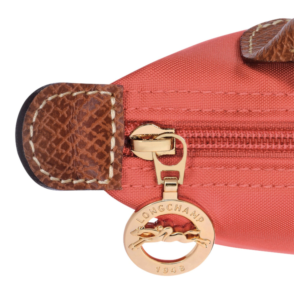 Lieblingstasche Longchamp Le Pliage Pochette in coral nylon with brown leather trim and gold logo zipper pull