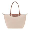 Lieblingstasche Longchamp Le Pliage large shoulder bag in beige nylon with brown leather handles and gold hardware