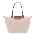 Lieblingstasche Longchamp Le Pliage large shoulder bag in beige nylon with brown leather handles and gold hardware