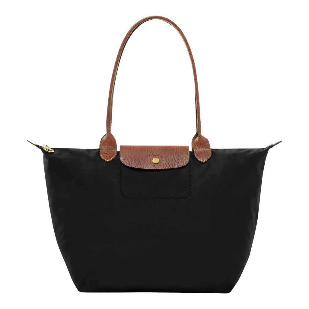 Lieblingstasche Longchamp Le Pliage large black nylon shoulder bag with brown leather handles and gold hardware.