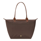 Lieblingstasche Longchamp Le Pliage large brown nylon shoulder bag with tan leather handles and gold snap button.