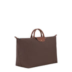 Lieblingstasche Longchamp Le Pliage XL travel bag in brown nylon with brown leather handles and gold-tone snap button.