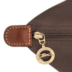 Lieblingstasche Longchamp Le Pliage shoulder bag detail featuring brown nylon fabric, leather trim, and gold zipper