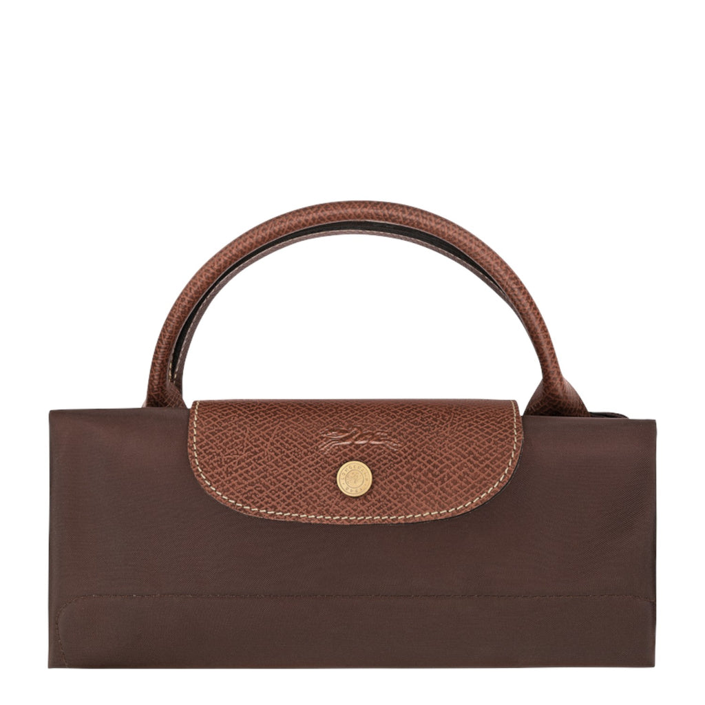 Lieblingstasche Longchamp Le Pliage XL travel bag in brown, folded into a compact shape with leather flap and gold snap.