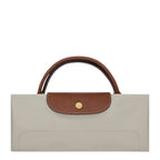Lieblingstasche Longchamp Le Pliage XL travel bag folded in beige nylon with brown leather trim and gold hardware