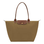 Lieblingstasche Longchamp Le Pliage large shoulder bag in khaki nylon with brown leather trim and gold hardware.
