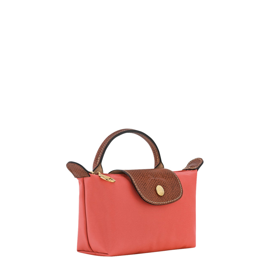 Lieblingstasche Longchamp Le Pliage Pochette in coral pink nylon with brown leather trim and gold hardware.