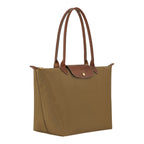 Lieblingstasche Longchamp Le Pliage large shoulder bag in khaki nylon with brown leather trim and gold hardware.