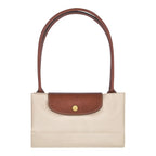 Lieblingstasche Longchamp Le Pliage shoulder bag in beige nylon with brown leather trim and gold snap button closure