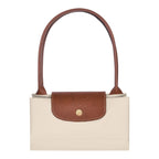 Lieblingstasche Longchamp Le Pliage medium shoulder bag in beige nylon with brown leather trim and gold hardware.