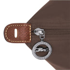 Lieblingstasche Longchamp Le Pliage travel bag brown nylon detail with silver logo zipper pull and leather tab