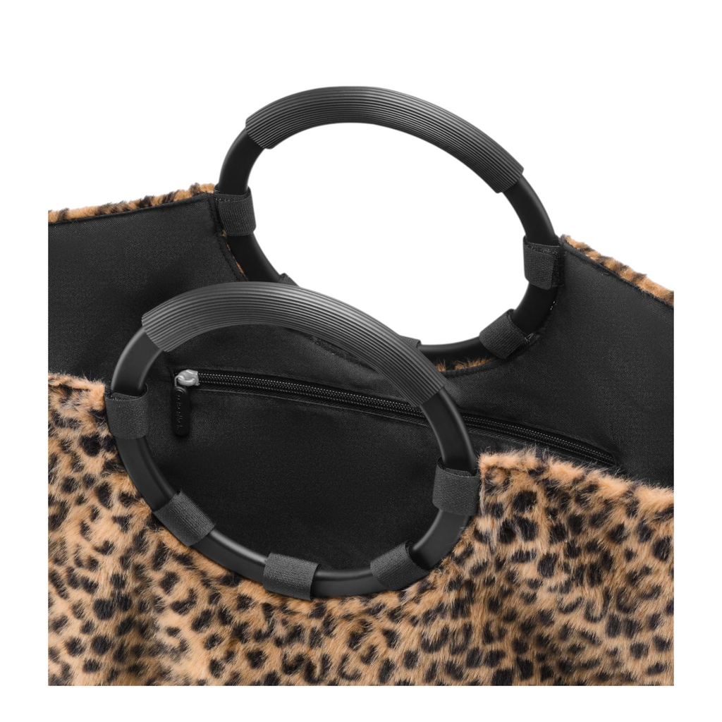 Lieblingstasche Loopbag Hobo featuring a leopard print faux fur texture and black circular rigid handles.