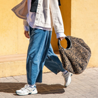 Lieblingstasche Loopbag Hobo featuring a leopard print faux fur texture and a circular black handle