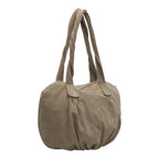 Lieblingstasche Lucy Shopper M in taupe suede leather with braided shoulder straps and a rounded silhouette