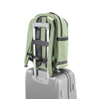 Lieblingstasche eoto Midi20 sage green city backpack with trolley sleeve attached to a silver suitcase
