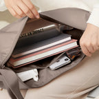 Lieblingstasche GOT BAG Moon Bag Large showing organized interior with books, water bottle, and phone