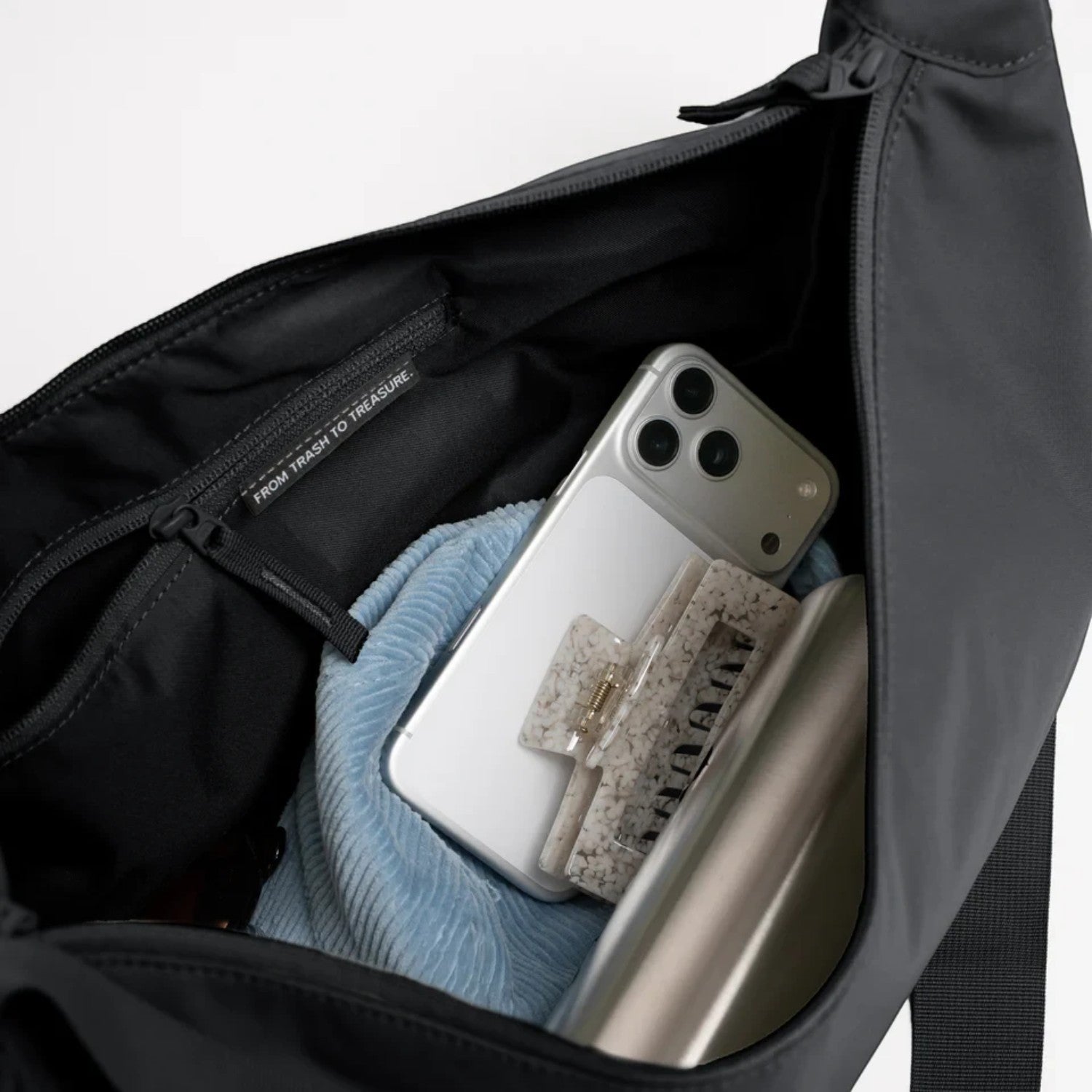 Lieblingstasche GOT BAG Moon Bag Large in black showing the spacious interior with a zippered pocket and accessories