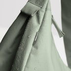 Lieblingstasche GOT BAG Moon Bag Large in sage green with water-repellent fabric texture and close-up detail.
