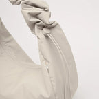 Lieblingstasche Moon Bag Ruffle Large in beige made from recycled fishing nets with a gathered shoulder strap
