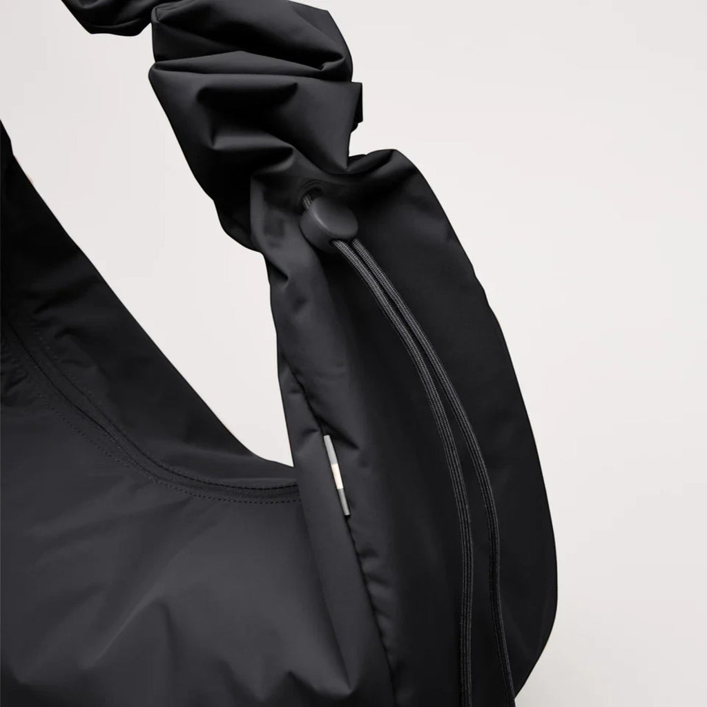 Lieblingstasche Moon Bag Ruffle Large in black made from sustainable recycled fishing nets with a gathered strap