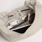 Lieblingstasche Moon Bag Ruffle Large in beige, showing the spacious interior with organized essentials.