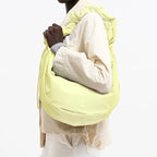 Lieblingstasche Moon Bag Ruffle Large in pale yellow with a gathered shoulder strap worn over the shoulder