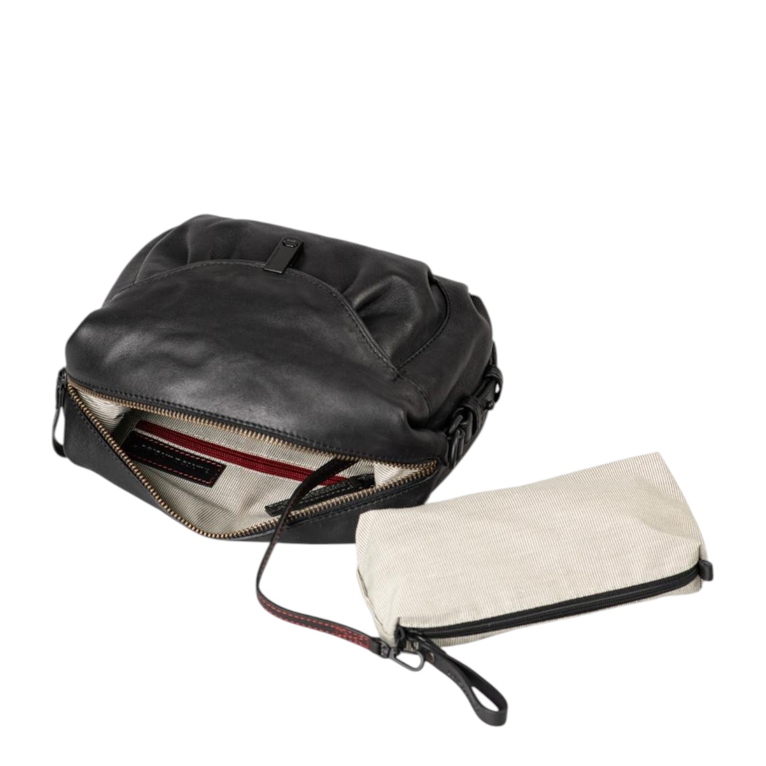 Lieblingstasche Mrs. Cannoli black leather crossbody bag with an open main compartment and a removable beige pouch