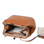 Lieblingstasche Mrs. Pizzelle brown leather handbag with a vintage-style kiss-lock clasp and striped interior lining.