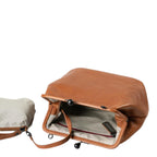 Lieblingstasche Mrs. Pizzelle brown leather handbag with a vintage-style kiss-lock clasp and striped interior lining.