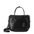 Lieblingstasche Mrs. Profiterole black leather handbag with dual top handles and a detachable shoulder strap.