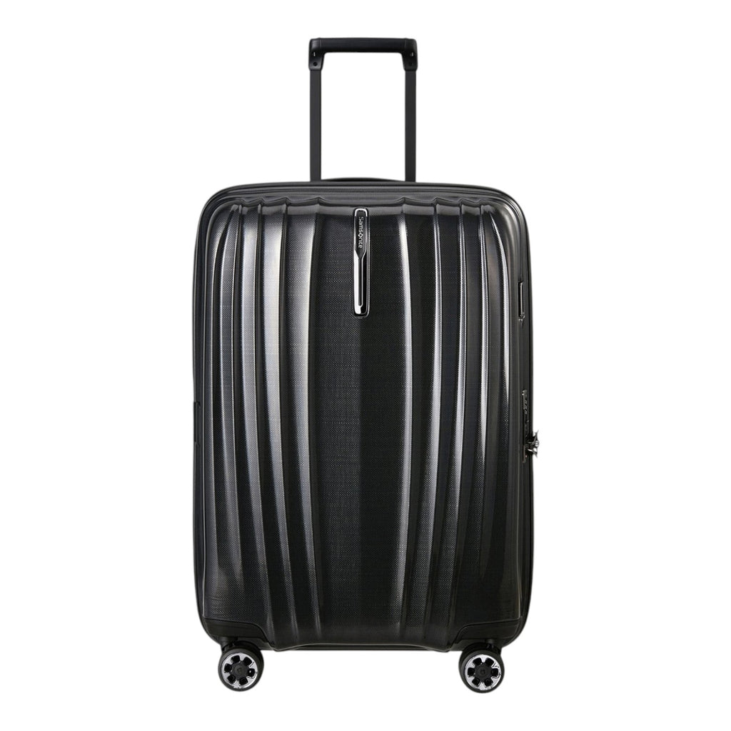 Lieblingstasche NEXIS Spinner 70/26 Exp black hard shell suitcase with vertical grooves and four spinner wheels