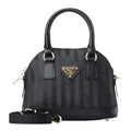 Lieblingstasche Oetwil black handbag with Mollerus logo pattern, gold hardware, and detachable shoulder strap
