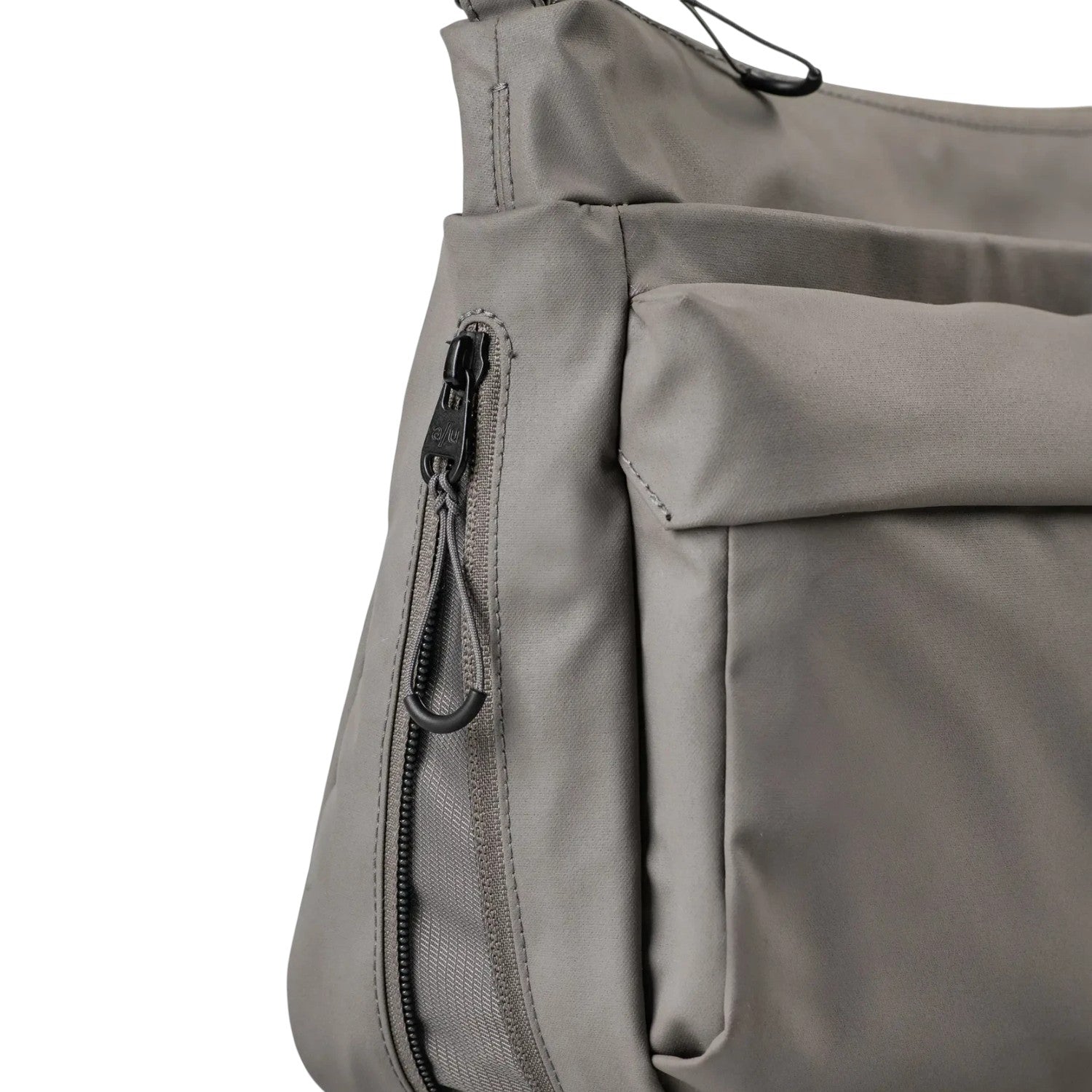 Lieblingstasche Omono RE lite grey crossbody bag featuring a side zipper pocket and durable synthetic fabric.