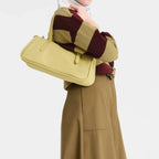Lieblingstasche pale yellow leather shoulder bag with top handle and zip closure