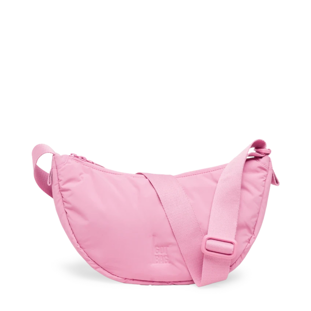 Lieblingstasche Cloud Moon Bag Small in light pink with a crescent shape, adjustable strap, and zippered closure.