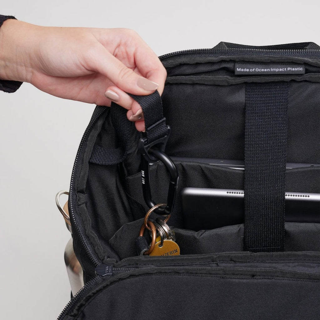Lieblingstasche Pro Pack black backpack interior with key carabiner, laptop compartment, and recycled plastic label