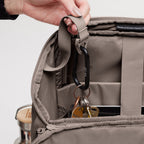 Lieblingstasche Pro Pack taupe backpack interior with keys on carabiner and water bottle.