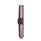 Lieblingstasche Secrid Miniwallet Pebble in purple textured leather with a metallic card protector side view