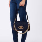 Lieblingstasche Crossbody M bag in quilted denim with brown faux fur trim, gold chain strap, and metal logo clasp.