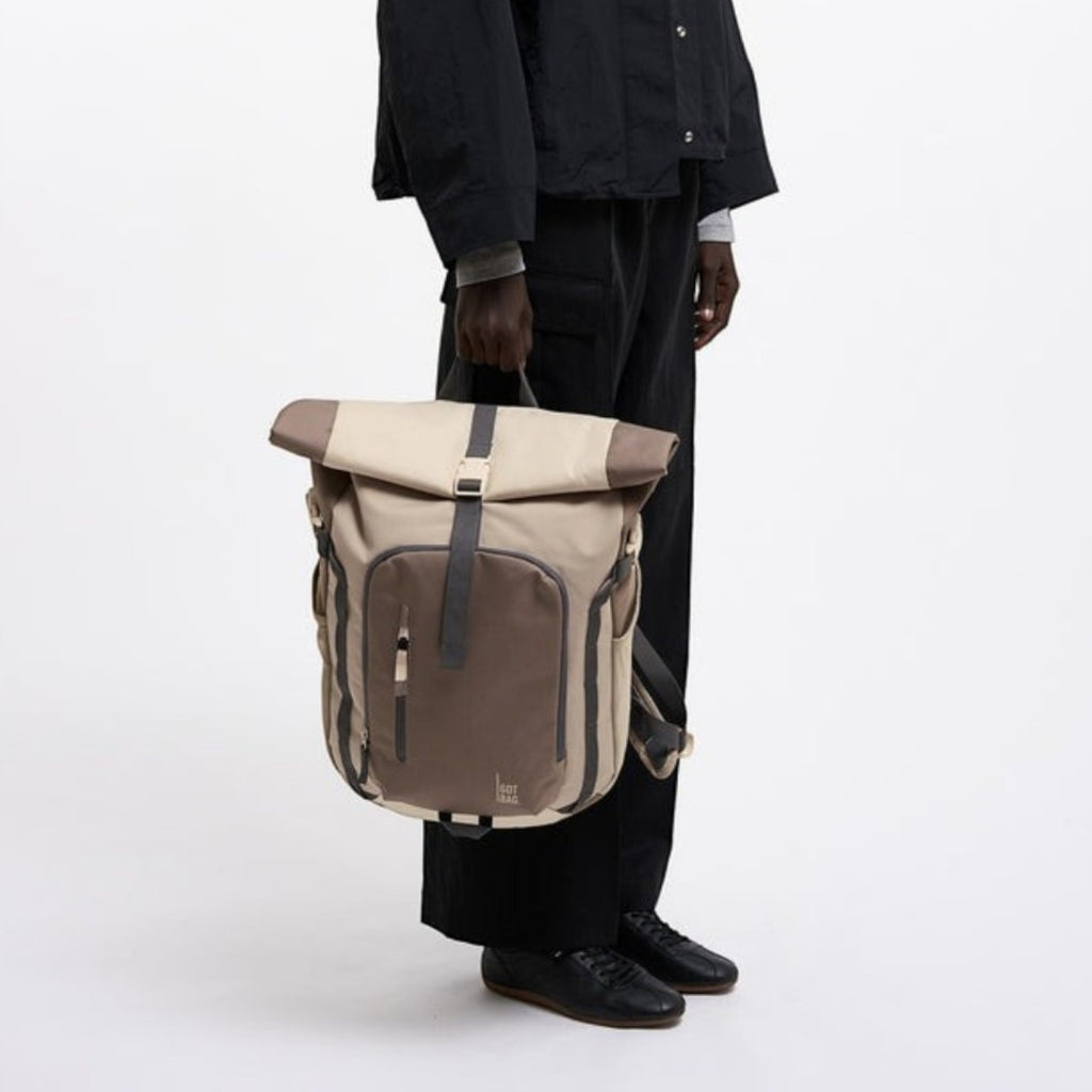 Lieblingstasche Rolltop Adventure backpack in beige and brown canvas with multiple pockets and adjustable straps.