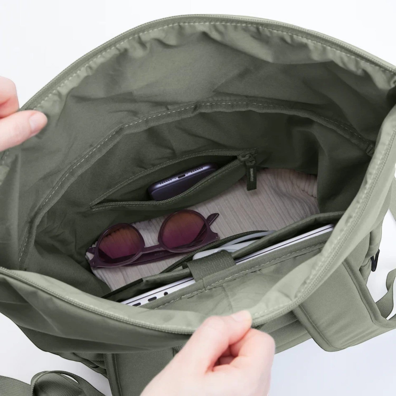 Lieblingstasche Rolltop Easy backpack interior in sage green with organized laptop sleeve and zippered pocket