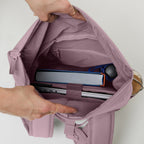 Lieblingstasche Rolltop Easy Small backpack interior with laptop, book, and water bottle. Dusty rose canvas.