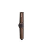 Lieblingstasche Secrid Miniwallet in brown leather with a secure snap closure and RFID-protected card mechanism.