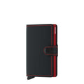 Lieblingstasche Secrid Miniwallet Matte in black leather with red stitching and a secure snap button closure.