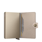 Lieblingstasche Secrid Miniwallet Pebble in beige leather with a metallic card protector and snap button closure
