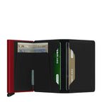 Lieblingstasche Secrid Slimwallet Matte in black leather with a red metal card protector and internal card slots.