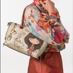 Lieblingstasche short handle bag with Time to Bloom graphic print, carried on the shoulder by a woman