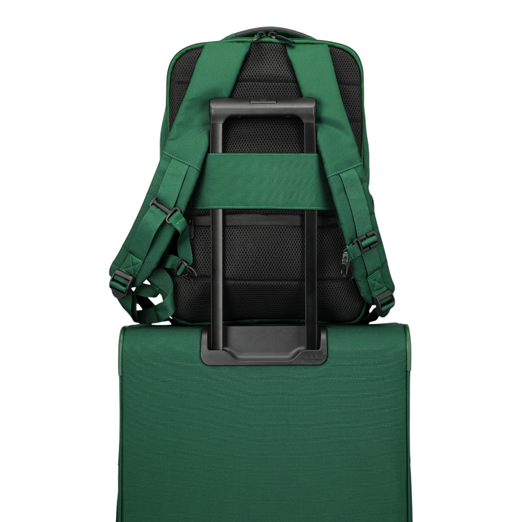 Lieblingstasche Skaii Rucksack M in green attached to a matching suitcase handle with padded back and straps